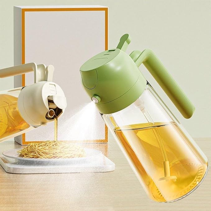 Oil sprayer releasing a fine mist of oil over a plate of noodles